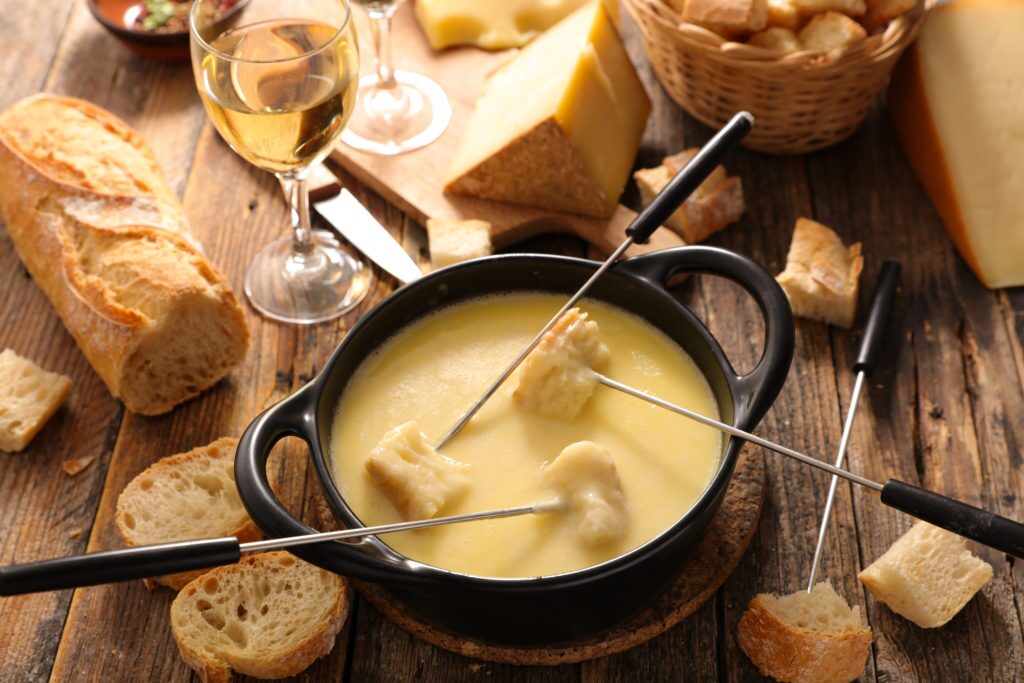 Swiss half-and-half fondue made with Gruyère and Emmental cheeses impact of american customs taxes on switzerland